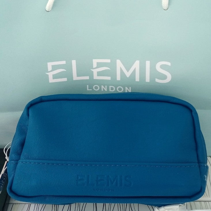 Blue toiletry bag with ' Elemis' branding on a light blue background