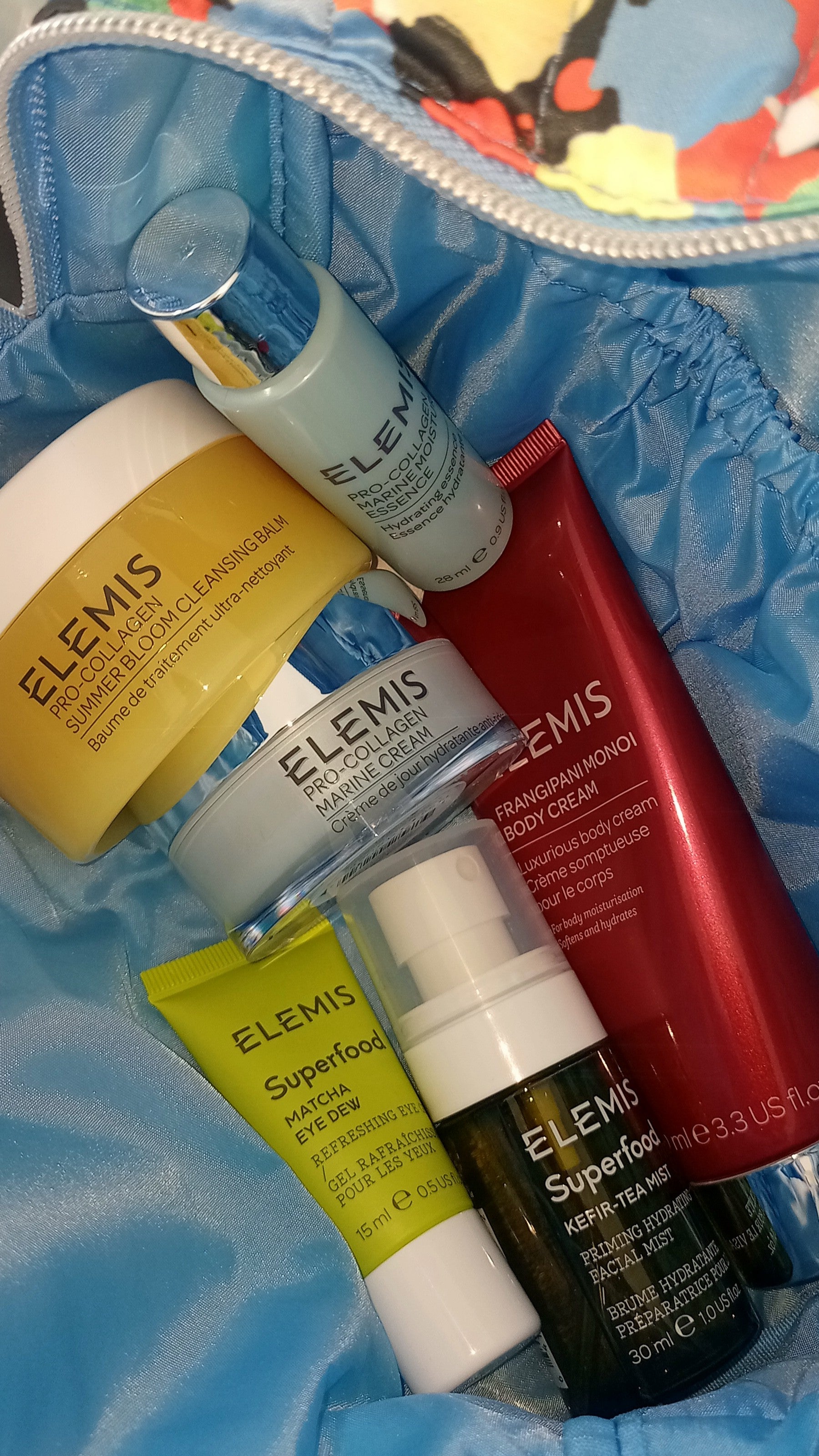 Collection of Elemis skincare products on a blue textured background north cyprus trnc