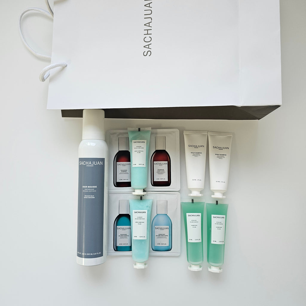 Set of skincare products with a Sachajuan branded bag on a white background - Available in Trnc 